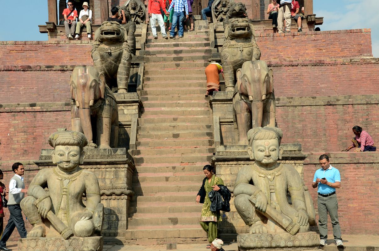 Kathmandu Bhaktapur 06-4 Nyatapola Temple Stairway WithJayamel and Phattu Wrestlers and Pairs Of Elephants, Lions, Beaked Griffons and Godesses Baghini and Singhini 